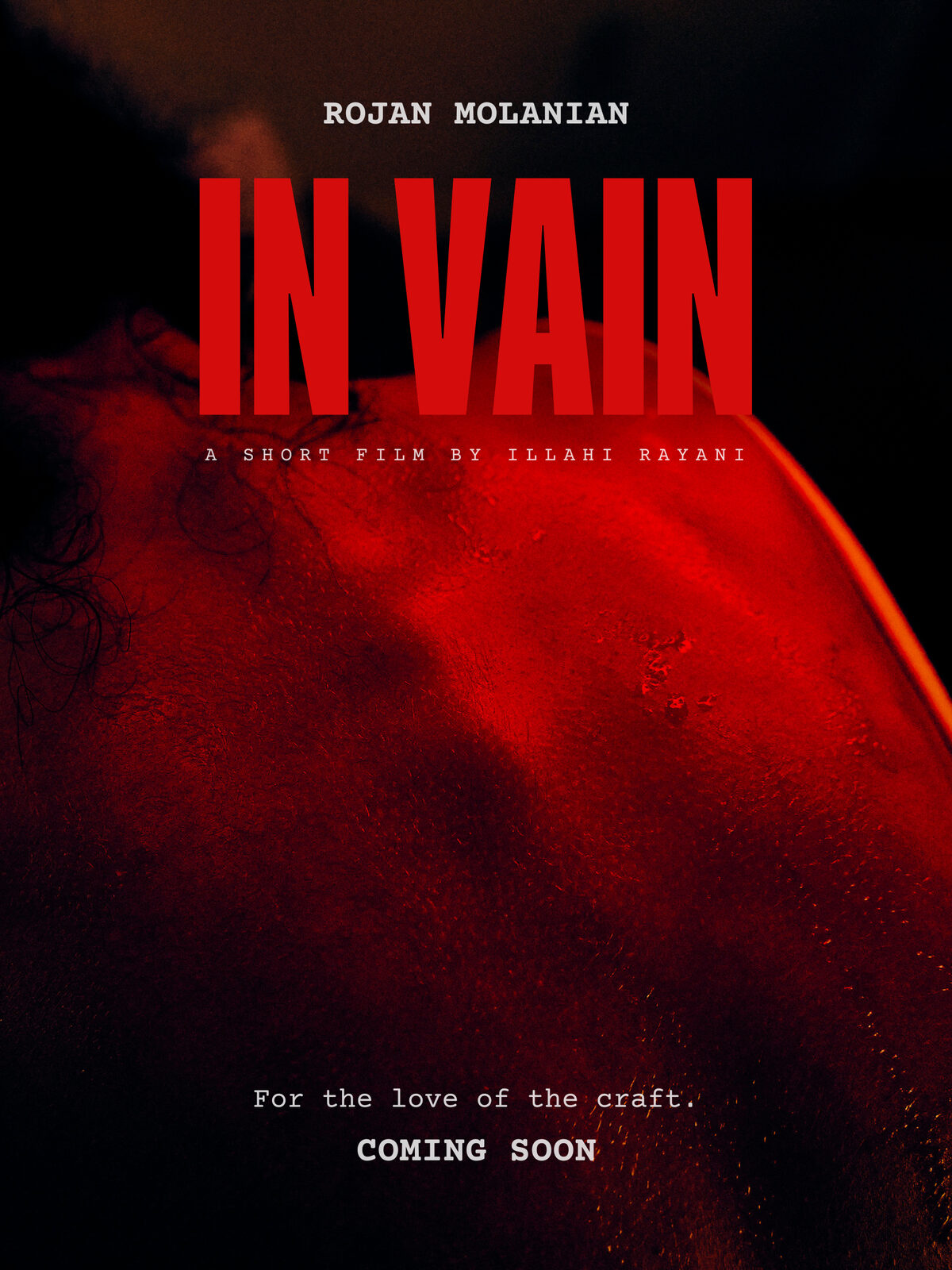 In Vain poster, the Actor's back under hard red light.
